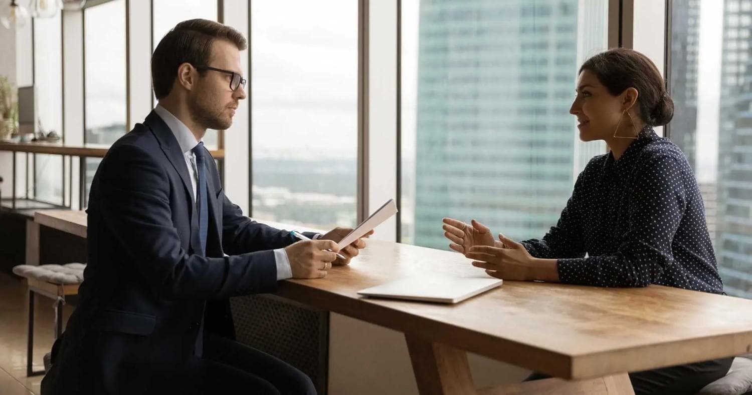 A cross-border talent discussion overlooking a city skyline.