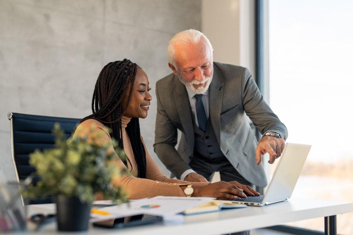 Two executives shaking hands, representing a trusted confidential search engagement.